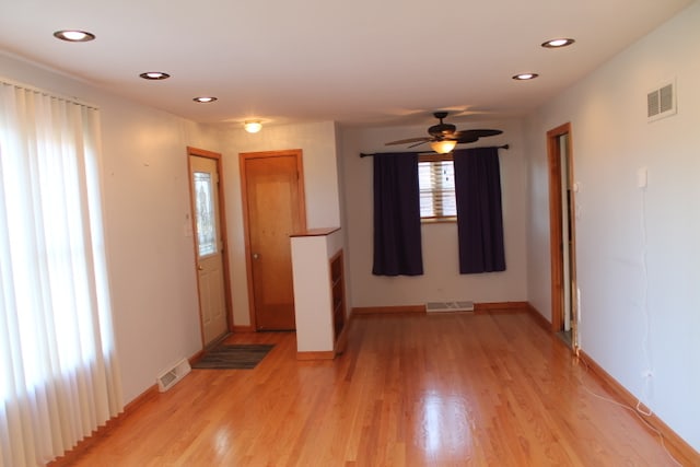 interior space with ceiling fan and light hardwood / wood-style flooring