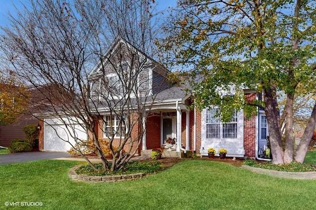 view of front of house featuring a garage and a front yard