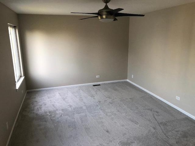 carpeted empty room with ceiling fan