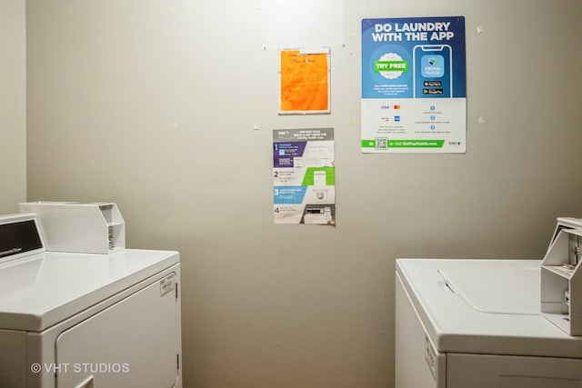 washroom with independent washer and dryer