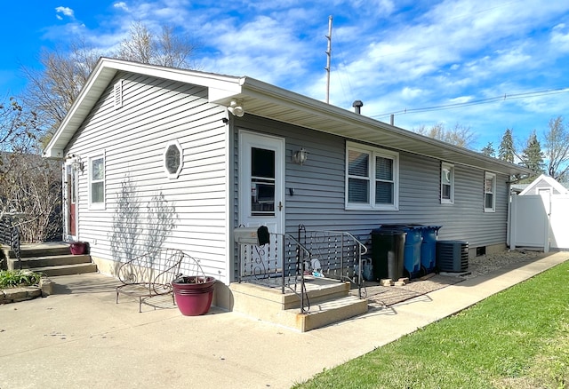 back of house featuring a patio area and central AC