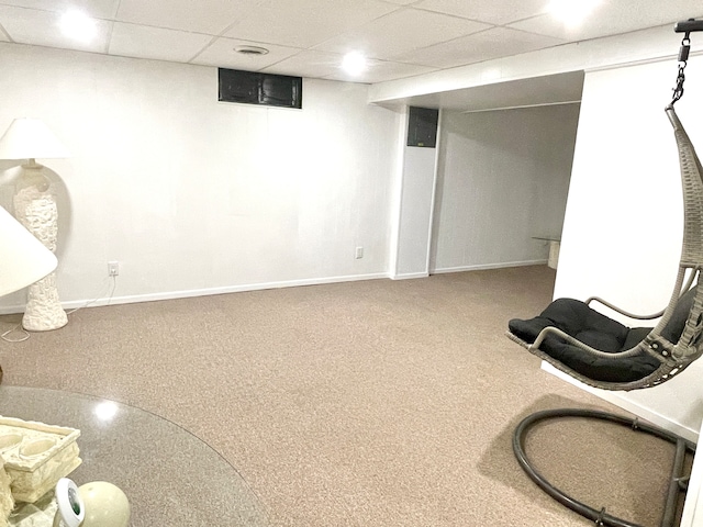 basement with carpet and a drop ceiling