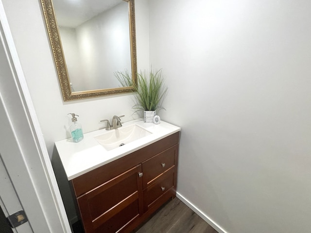 bathroom featuring hardwood / wood-style floors and vanity