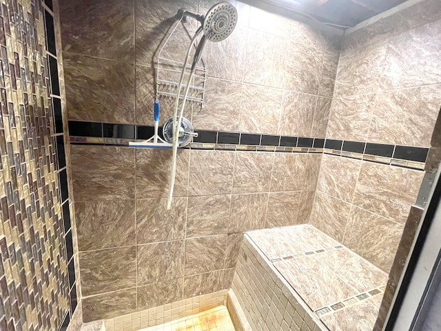 bathroom featuring tiled shower