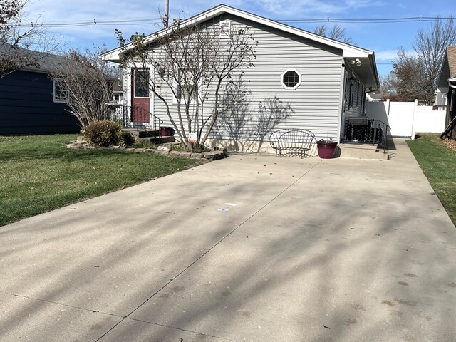 back of house featuring a yard