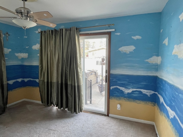 unfurnished room featuring carpet flooring and ceiling fan