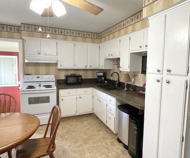 kitchen with white cabinets, white electric range oven, ceiling fan, and sink