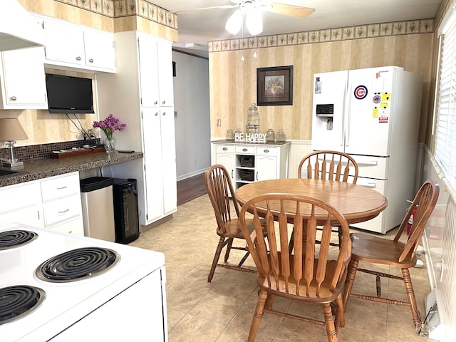 kitchen with ceiling fan, white cabinetry, white appliances, and light tile patterned floors