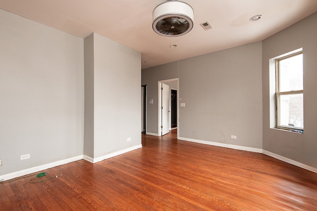 empty room featuring hardwood / wood-style flooring