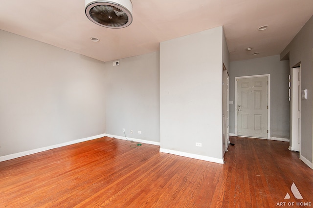 empty room featuring dark wood-type flooring