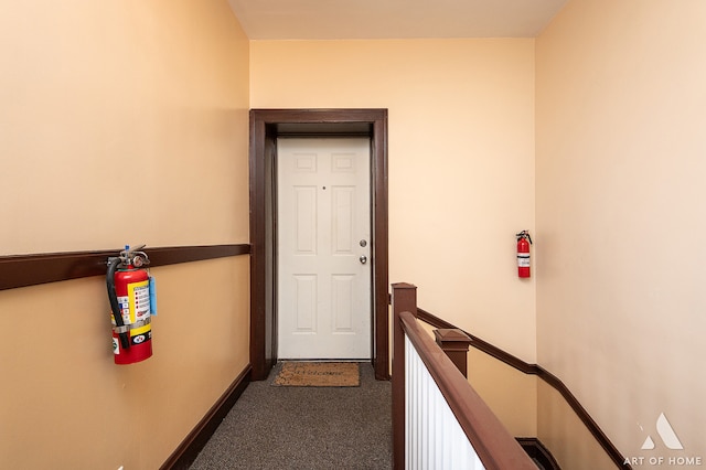 interior space with dark colored carpet