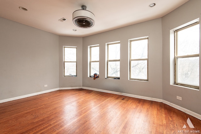 spare room featuring hardwood / wood-style floors