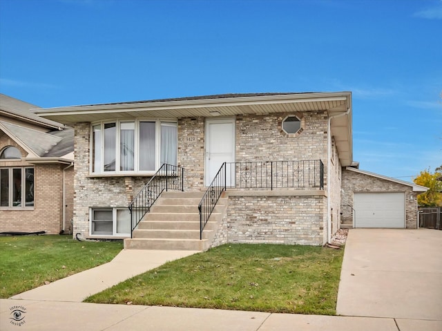 view of front of property featuring a garage and a front lawn