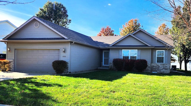 view of front facade with a front yard and a garage