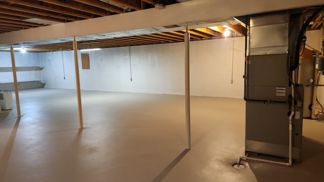 basement featuring heating unit