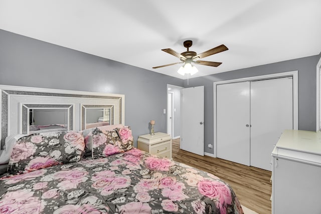 bedroom featuring a closet, light wood-type flooring, and ceiling fan