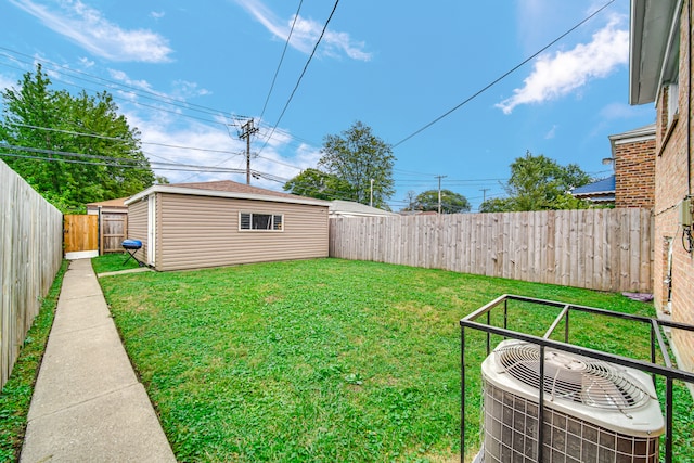 view of yard with a shed and cooling unit