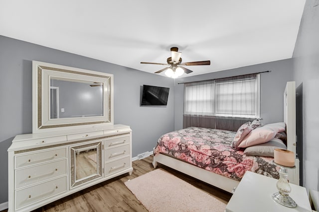 bedroom featuring ceiling fan and light hardwood / wood-style flooring