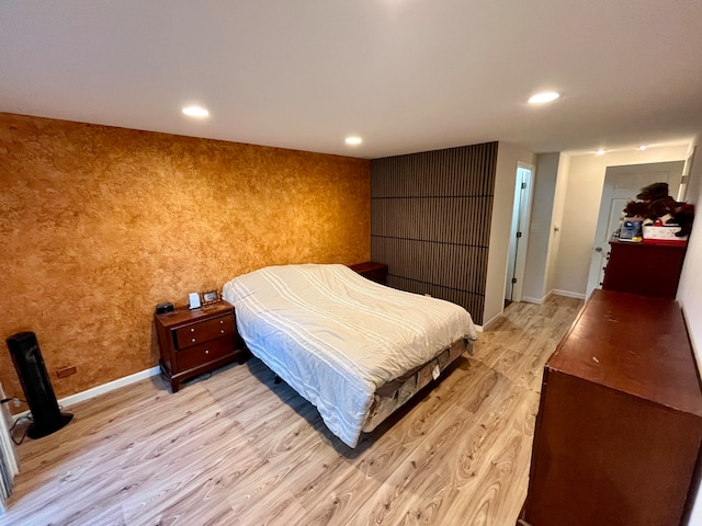 bedroom with light wood-type flooring