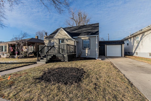 view of front facade featuring a wooden deck, a garage, and a front yard