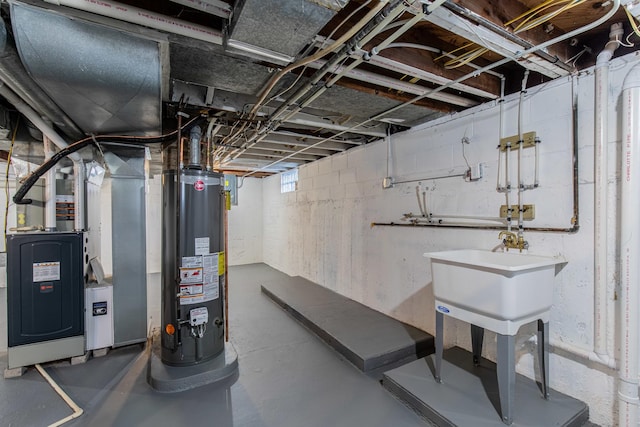 basement with heating unit, sink, and water heater