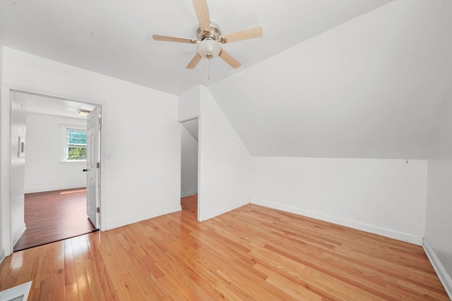 bonus room featuring ceiling fan, light wood-type flooring, and vaulted ceiling