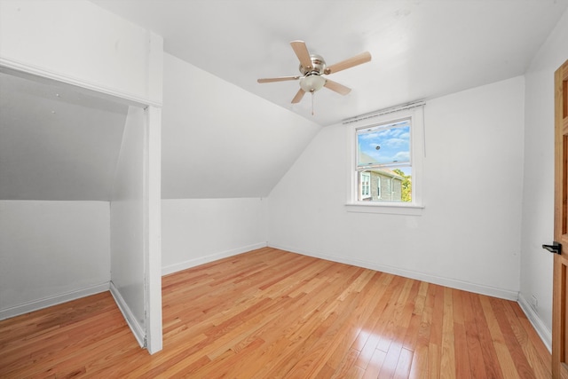 bonus room featuring ceiling fan, light wood-type flooring, and lofted ceiling