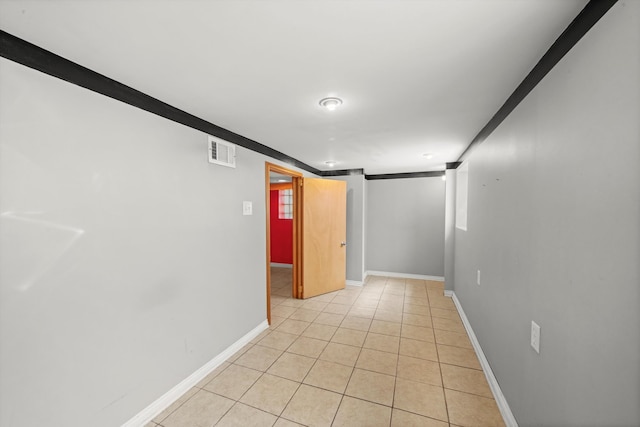 hall with light tile patterned flooring