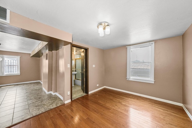 empty room featuring wood-type flooring