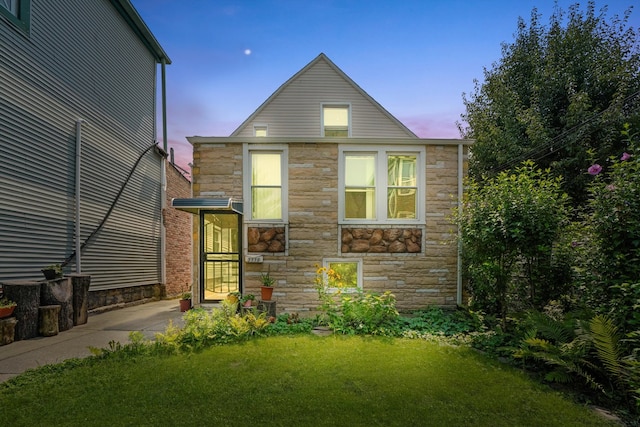 view of front of home with a yard