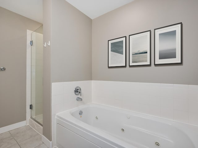 bathroom featuring tile patterned flooring and shower with separate bathtub