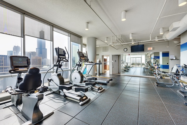 gym featuring a textured ceiling