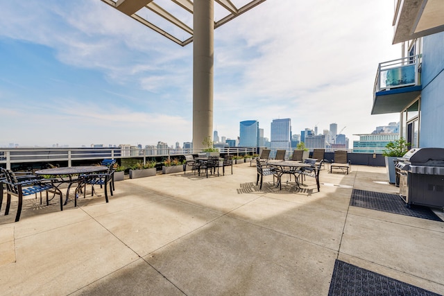 view of patio / terrace featuring a pergola and a grill