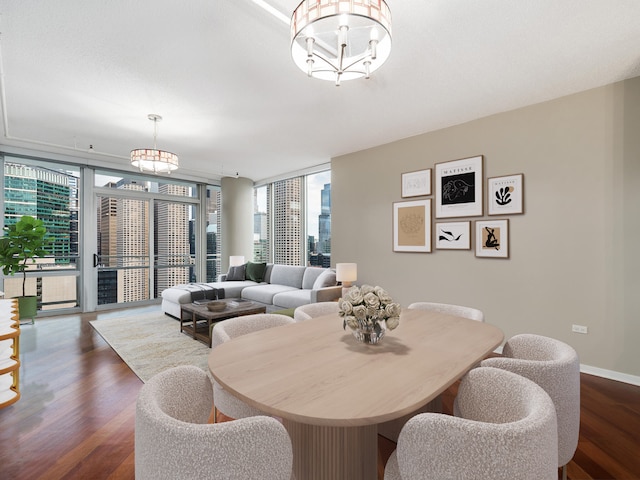 dining space with a wall of windows, a wealth of natural light, and dark hardwood / wood-style floors