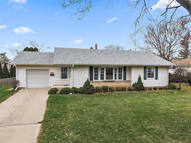 single story home featuring a garage and a front lawn