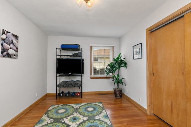 living area with wood-type flooring