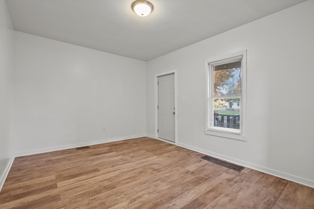 spare room with light hardwood / wood-style floors