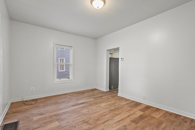 spare room with light wood-type flooring