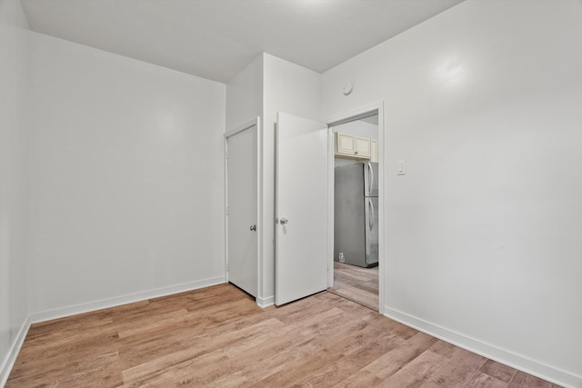 unfurnished room featuring light wood-type flooring