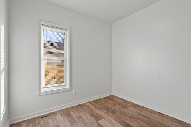 unfurnished room featuring light hardwood / wood-style flooring