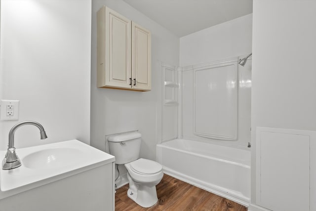 full bathroom featuring shower / bath combination, wood-type flooring, toilet, and vanity