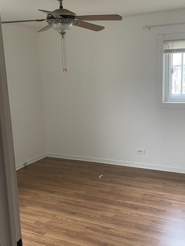 unfurnished room featuring hardwood / wood-style flooring and ceiling fan