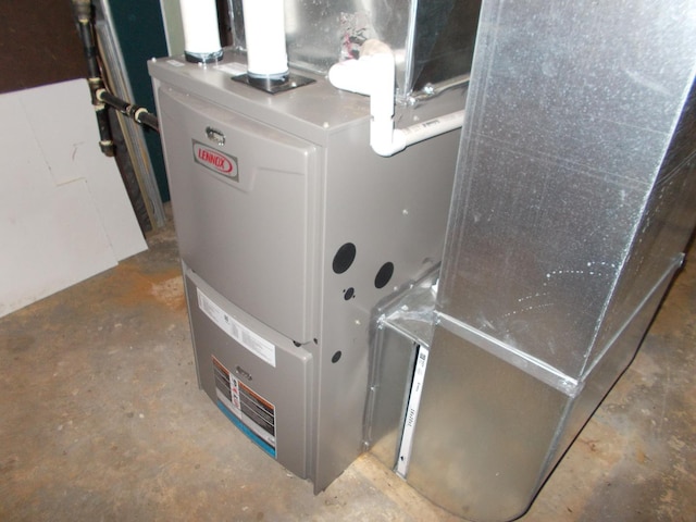 utility room with heating unit