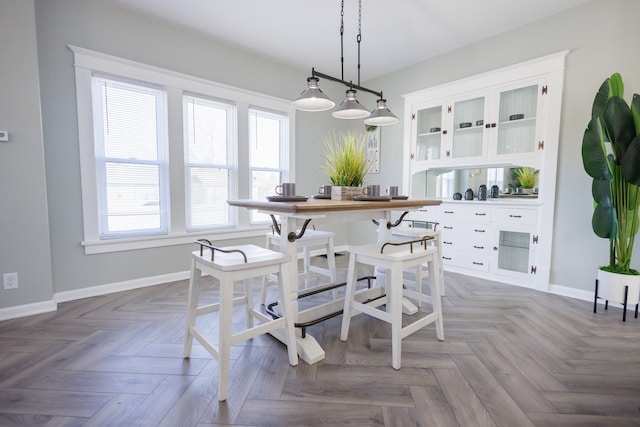 dining room with parquet flooring