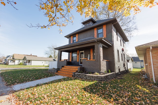 view of front of property with a porch and a front yard