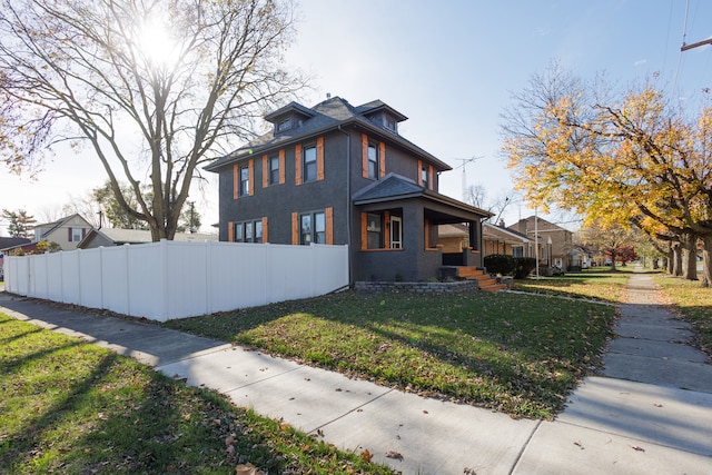 view of side of property featuring a yard