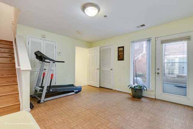 workout area with light parquet flooring