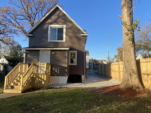 back of property featuring a patio