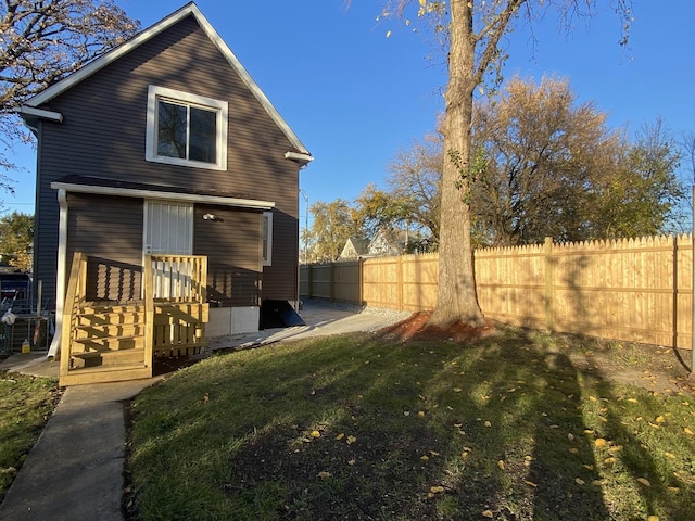 rear view of house with a yard