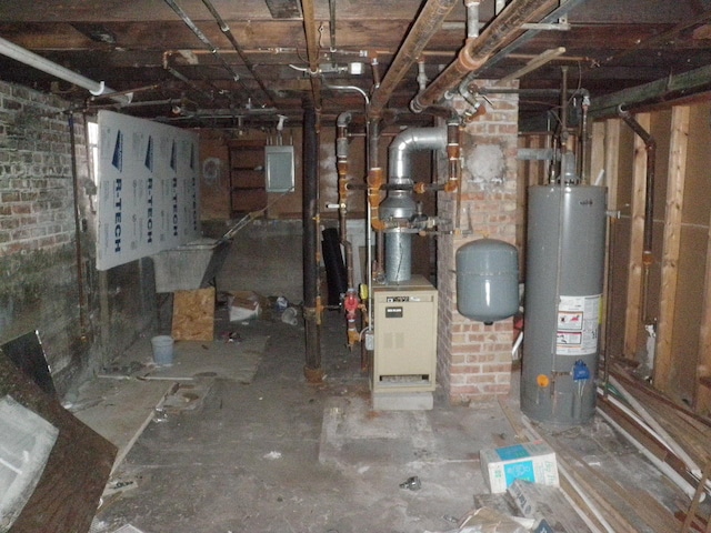 utility room featuring water heater